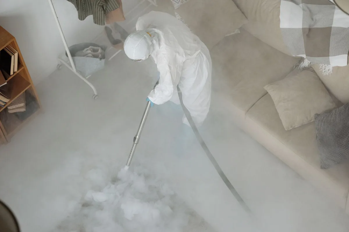 Biohazard cleanup technician in protective equipment, Bastrop, LA